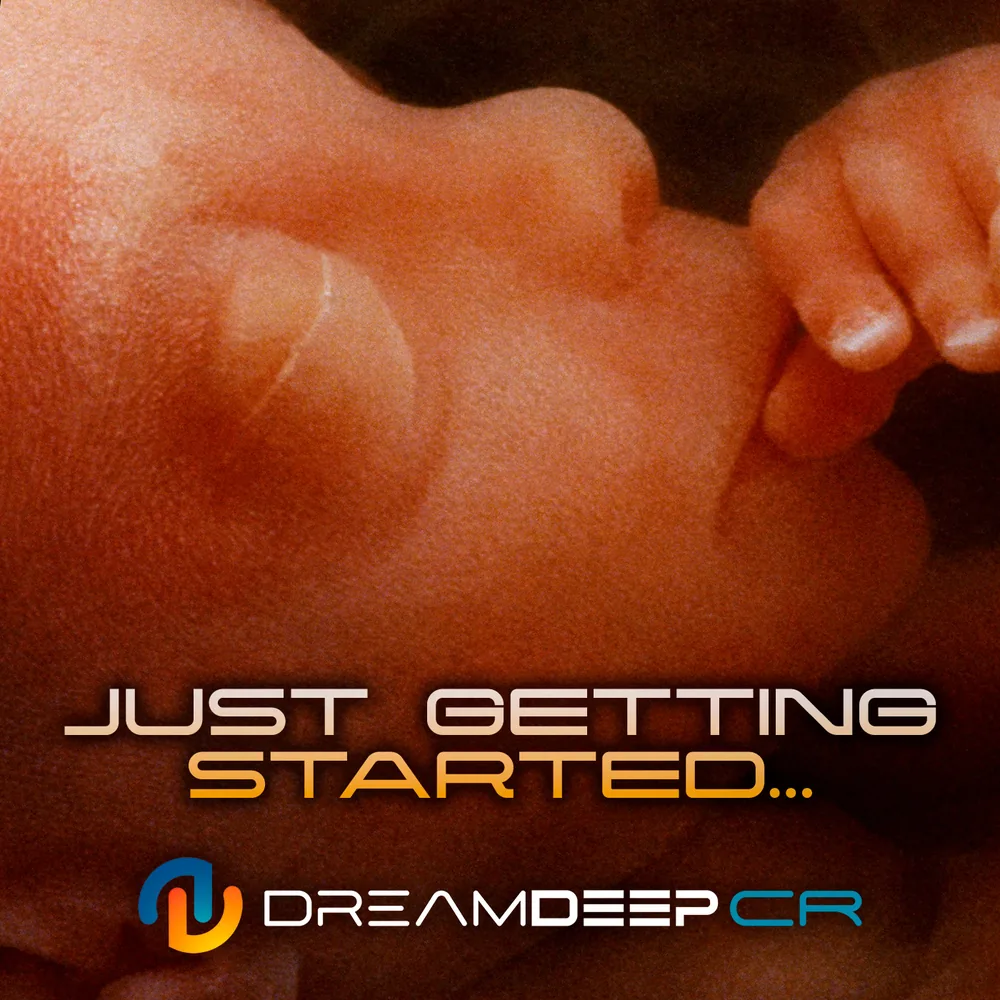 The cover of Just Getting Started by DreamDeep CR: a close-up of a newborn baby's face and hand in warm light, with the title in gold letters. The cover of Just Getting Started by DreamDeep CR: a close-up of a newborn baby's face and hand in warm light, with the title in gold letters.